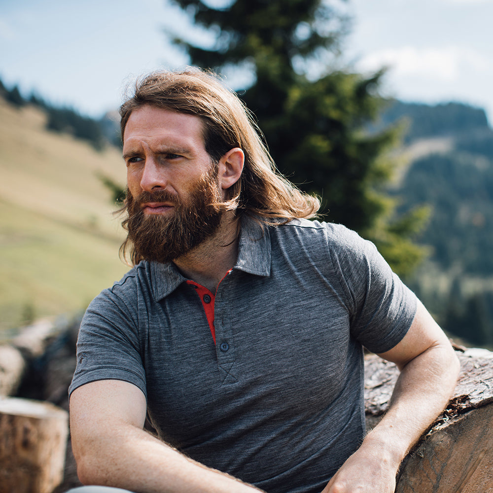 Isobaa | Mens Merino 180 Short Sleeve Polo Shirt (Black) | The ultimate Merino wool polo — perfect for weekend hikes, bike commutes, post-adventure coffee stops, office days, and everything in-between. | Model: Craig