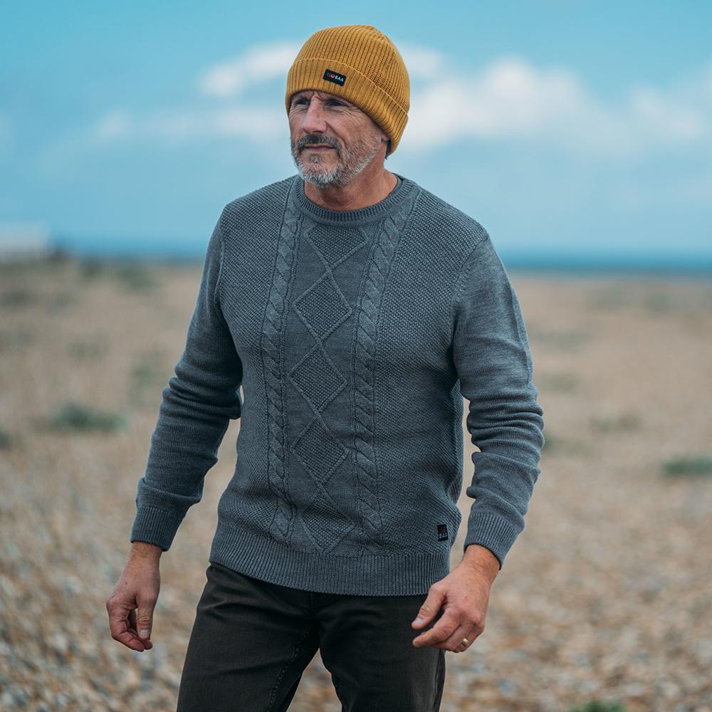 Isobaa | Mens Merino Cable Sweater (Charcoal) | Experience timeless style and outdoor-ready performance with our Merino wool crew neck sweater. | Model: Simon