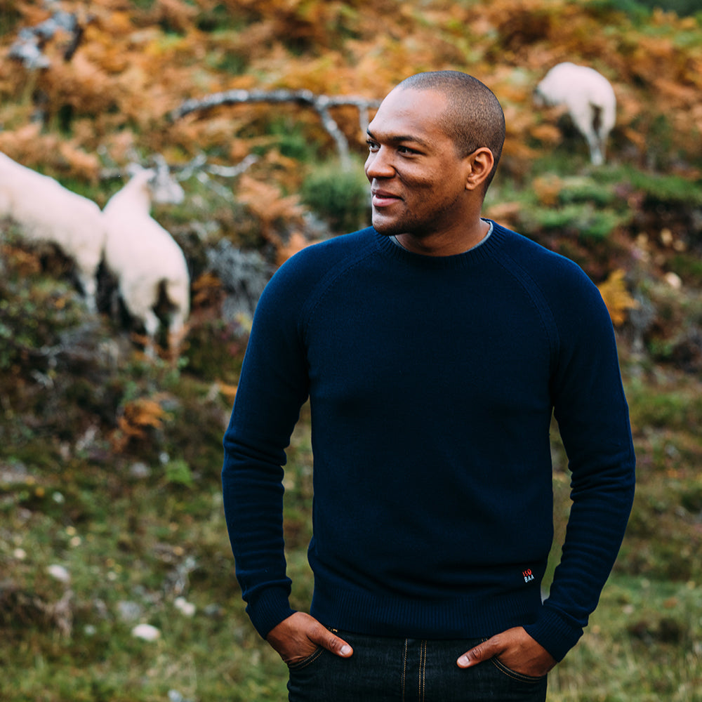 Isobaa | Mens Merino Moss Stitch Sweater (Navy/Denim) | Discover timeless style and outdoor-ready comfort with our extrafine Merino wool crew neck sweater. | Model: Edirin