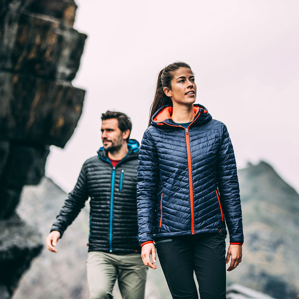 Isobaa | Womens Merino Wool Insulated Jacket (Navy/Orange) | Innovative and sustainable design with our Merino jacket. | Model: Jess