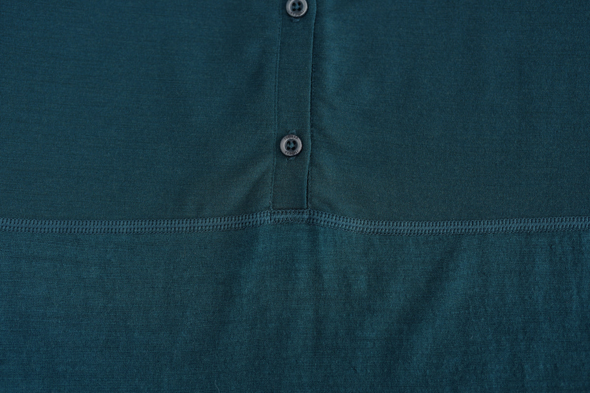 Close-up of a merino fabric showing reinforced upper-chest/shoulder panels