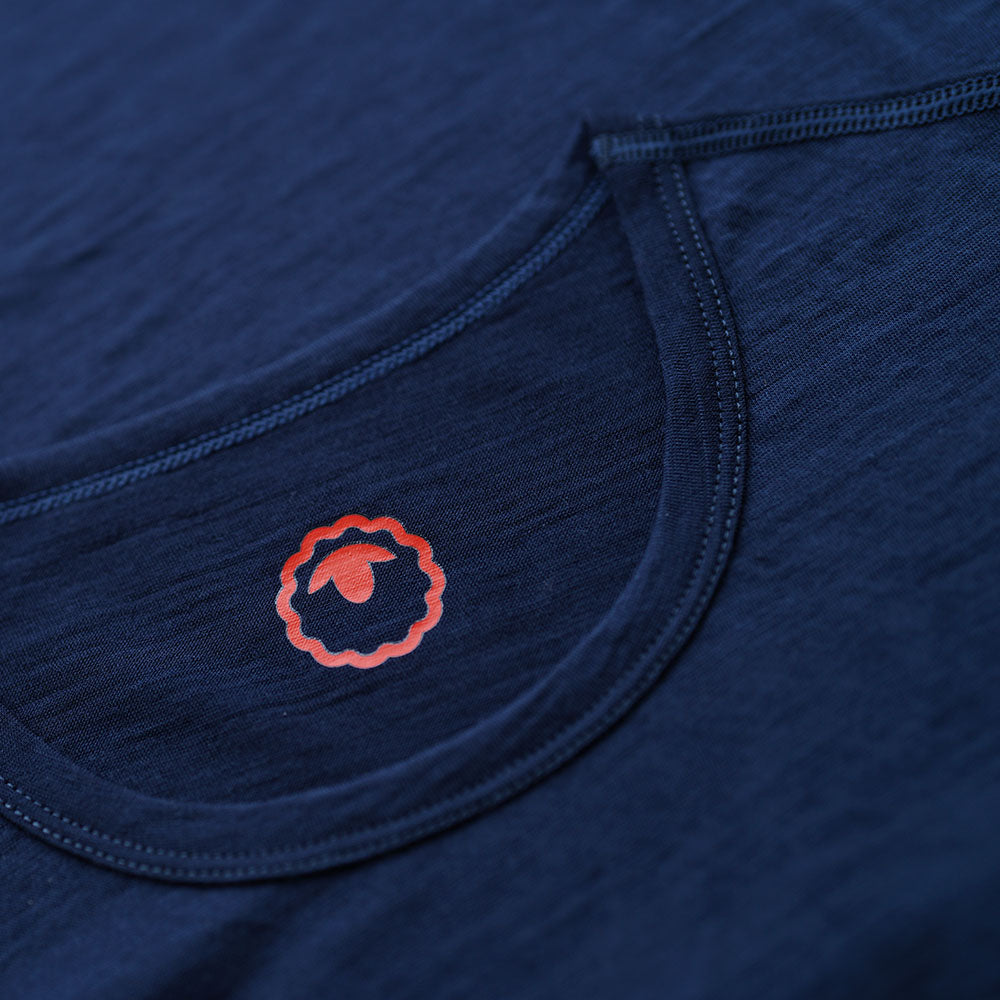 Isobaa | Mens Merino 150 Emblem Tee (Navy/Orange) | Conquer trails and city streets in comfort with Isobaa's superfine Merino T-Shirt.