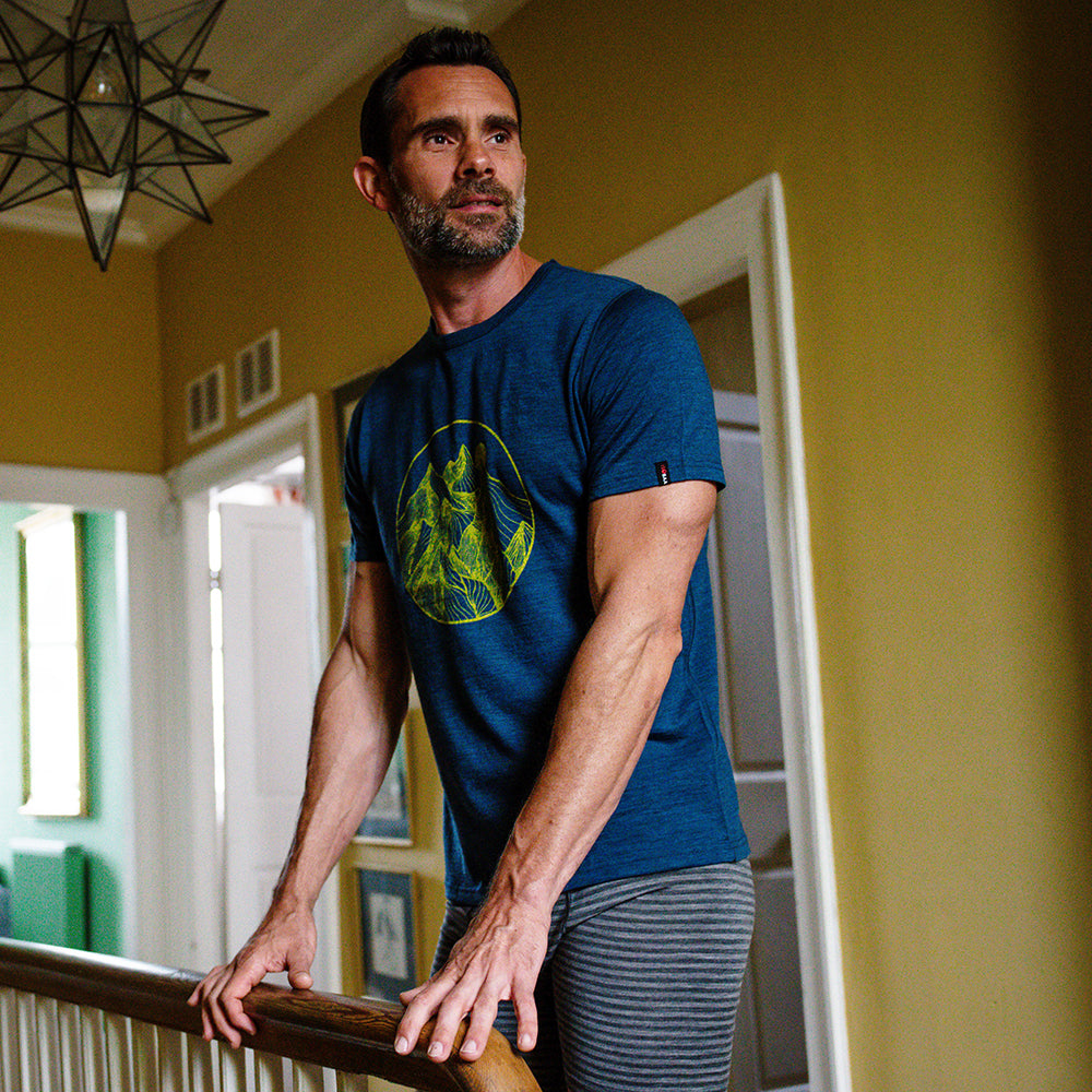 Isobaa | Mens Merino 150 Mountains Tee (Petrol/Lime) | Gear up for adventure with our superfine Merino Tee. | Model: Ben