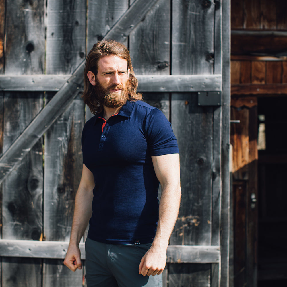 Isobaa | Mens Merino 180 Short Sleeve Polo Shirt (Black) | The ultimate Merino wool polo — perfect for weekend hikes, bike commutes, post-adventure coffee stops, office days, and everything in-between. | Model: Craig