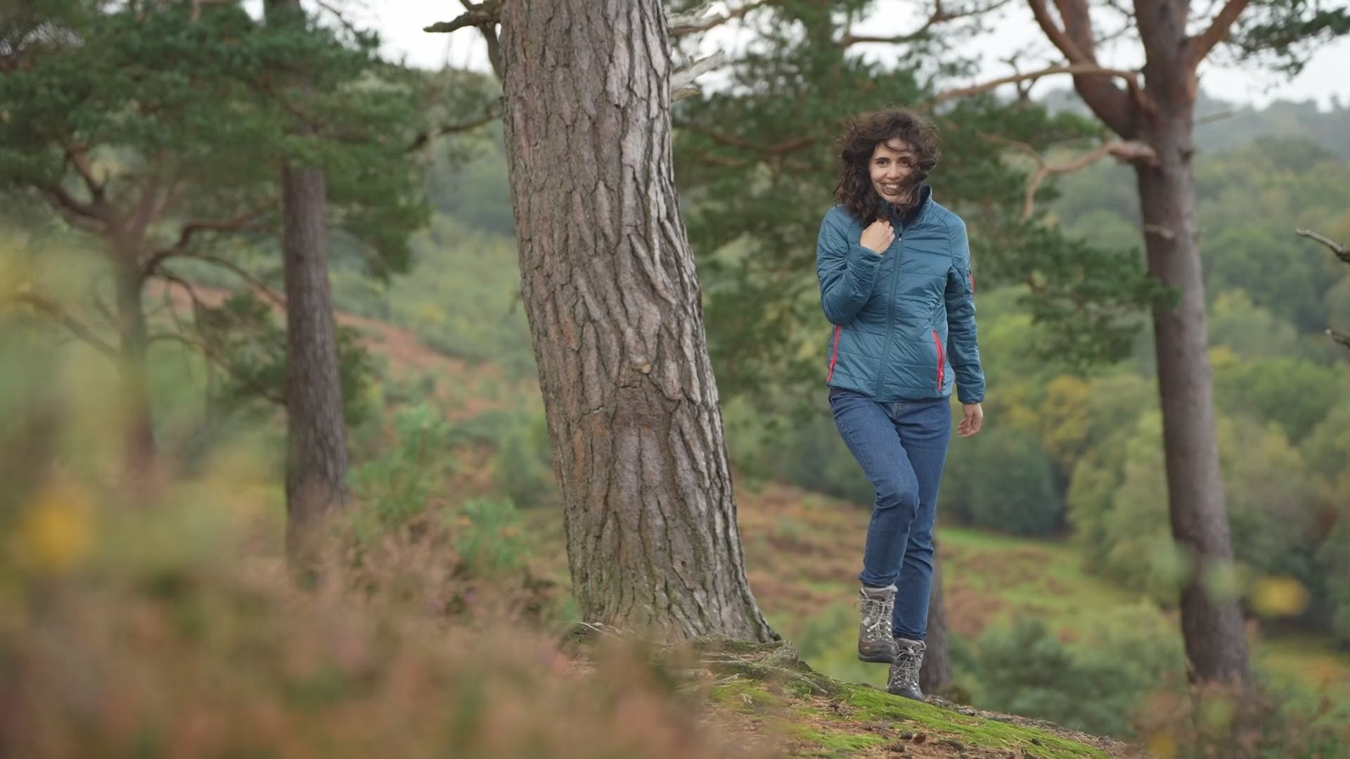 Isobaa | Womens Packable Insulated Jacket (Petrol/Orange) | Exceptional warmth, packable convenience, and sustainable design with our lightweight Merino wool jacket. | align: 75% 40% | Model: Clémentine