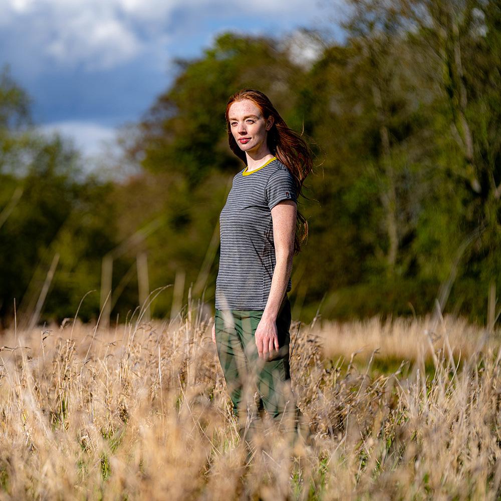 Isobaa | Womens Merino 150 Roll Sleeve Tee (Mini Stripe Smoke/Charcoal) | Our superfine Merino T-shirt performs everywhere from outdoor adventures to coffee dates. | Model: Sophie