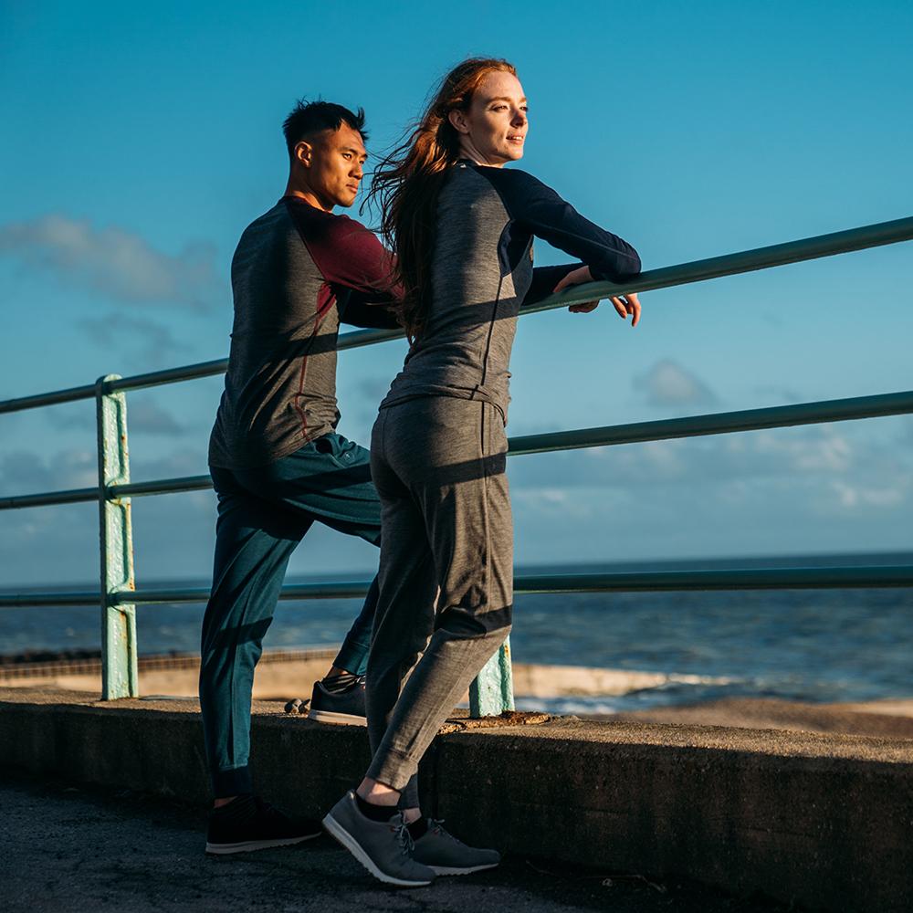 Isobaa | Womens Merino 260 Lounge Cuffed Joggers (Charcoal/Orange) | Discover unparalleled comfort and versatility with our luxurious 260gm Merino wool lounge joggers. | Model: Sophie