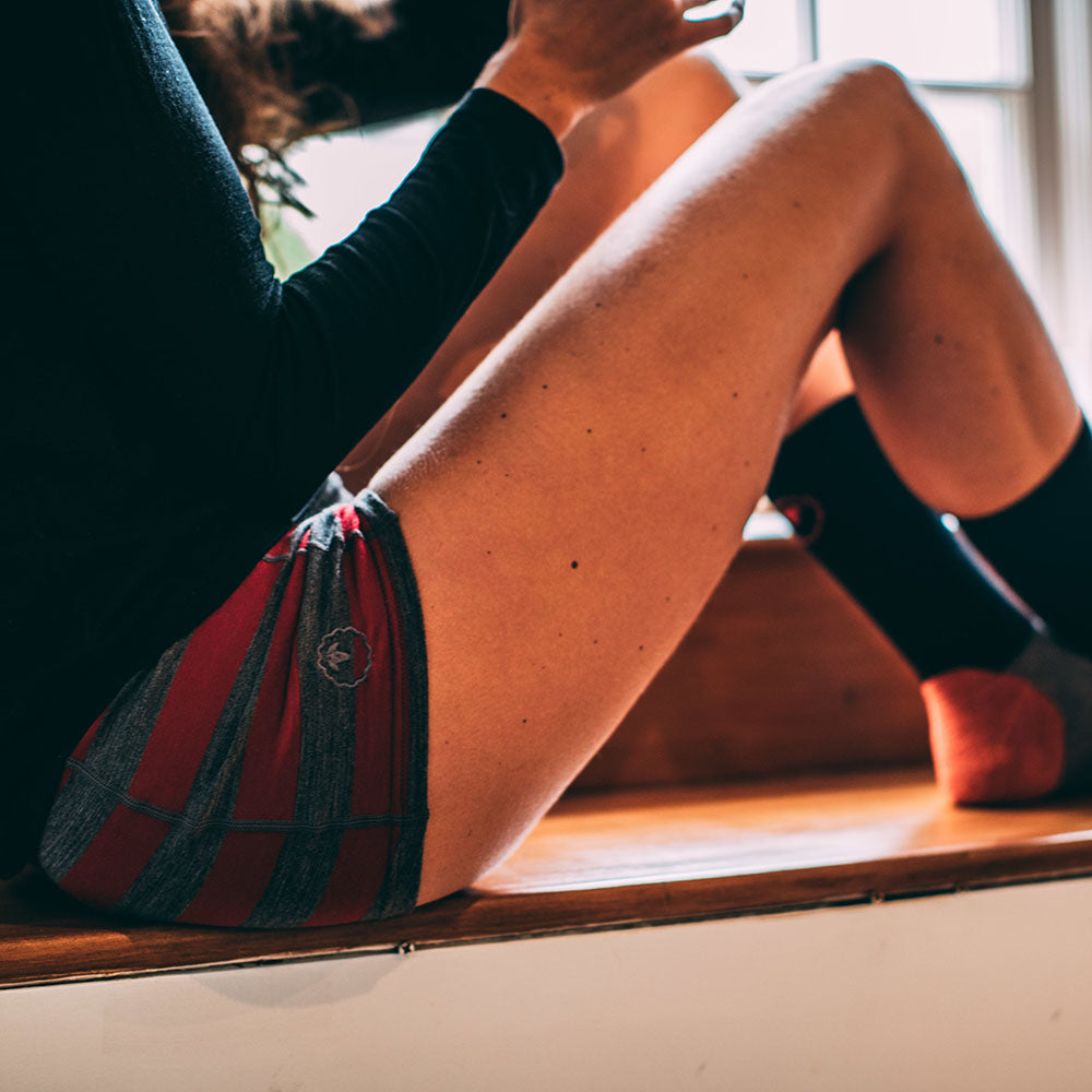 Isobaa | Womens Merino 180 Hipster Shorts (Smoke/Red) | Conquer any activity in comfort with Isobaa's superfine Merino hipster shorts. | Model: Jess