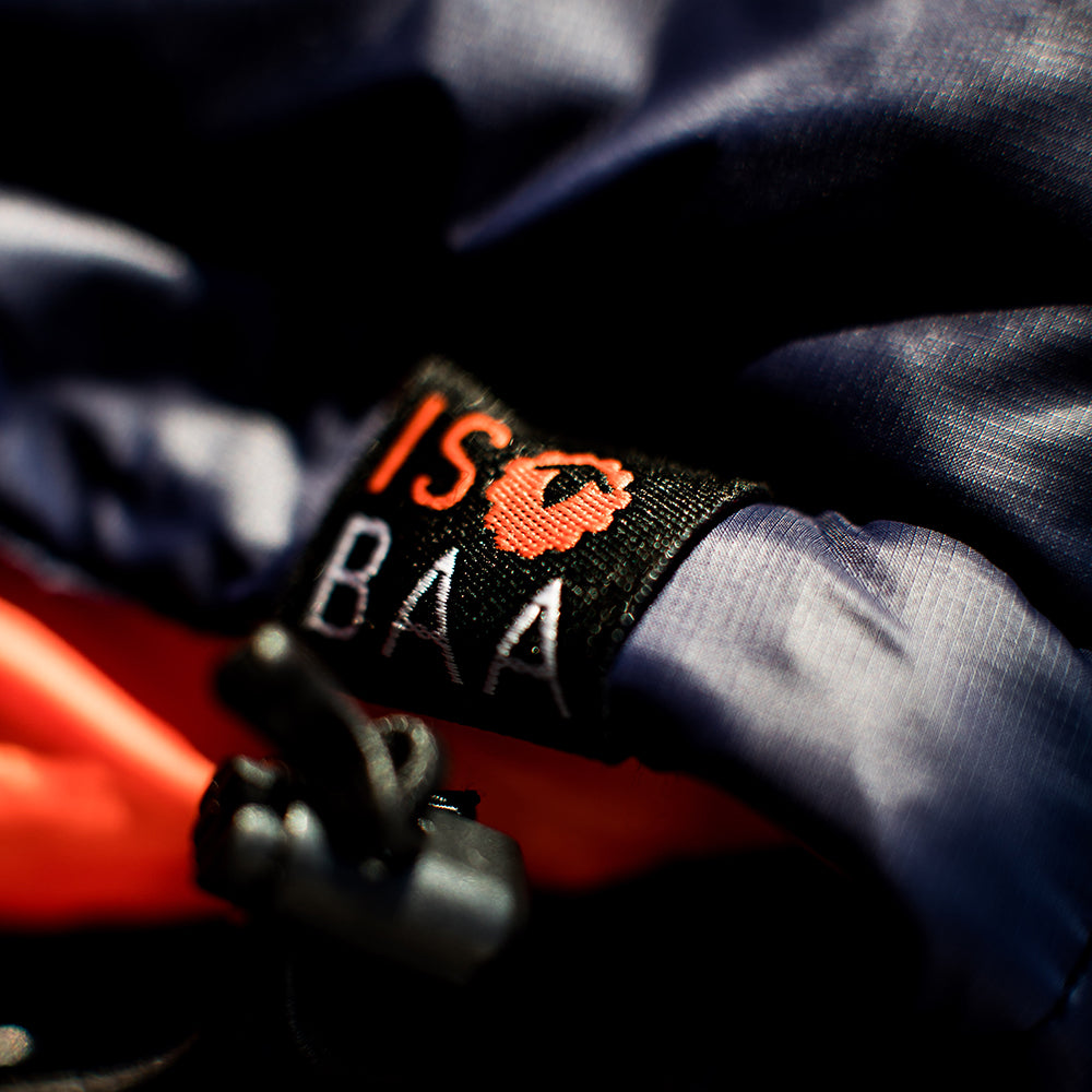 Isobaa | Womens Merino Wool Insulated Jacket (Navy/Orange) | Innovative and sustainable design with our Merino jacket.